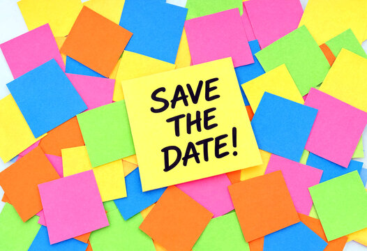 Brightly colored sticky notes with a prominent save the date reminder message displayed