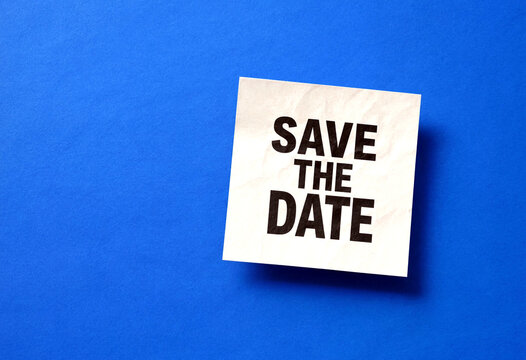 Bright blue background with a small white paper note saying save the date event reminder