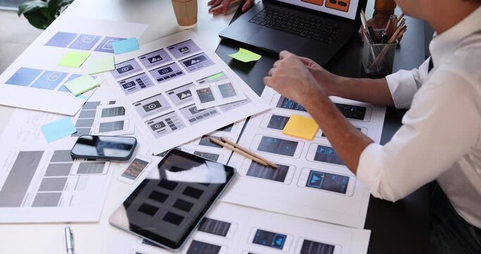 Design team hands actively working on ui ux design, planning and prototyping responsive web and mobile application development
