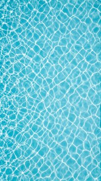 Top view of blue swimming pool water background texture with clear sunlit caustics ripples