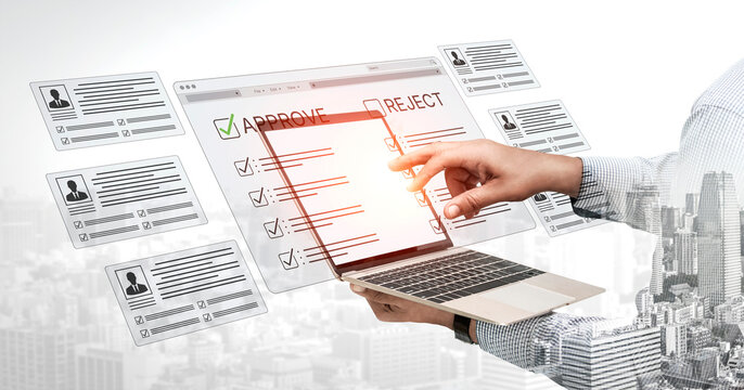 Businessman Reviewing Applications on Laptop with Approval and Rejection Options in a Modern Urban Setting. Bitwise.