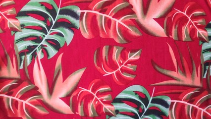 Vibrant Tropical Leaves Pattern on Red Background © NoblePix
