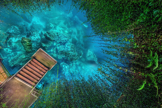 The View looking down the Ceiling Opening at Devil's Den Illuminated at Night, Levy County, Florida