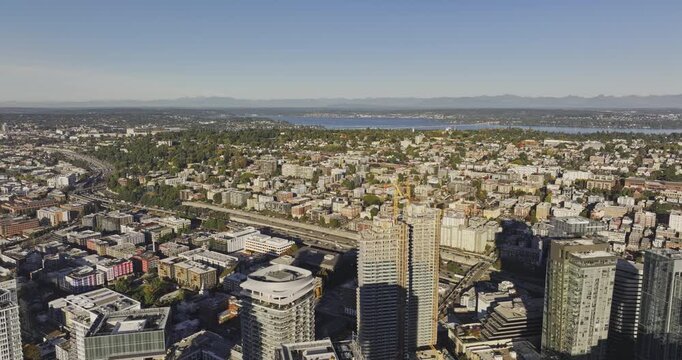 Seattle Washington Aerial v160 flyover above downtown, South Lake Union and Interstate 5 toward Capitol Hill, Lake Washington, Bellevue and the mountains - Shot with Mavic 3 Pro Cine - Oct 6th 2023