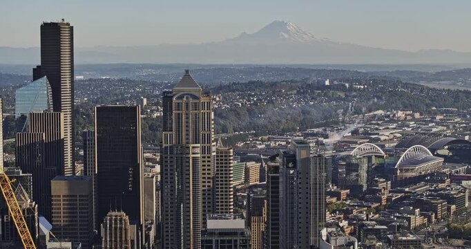 Seattle Washington Aerial v163 zoomed 3x tracking flyover from the waterfront and Sodo industrial area toward the downtown business district - Shot with Mavic 3 Pro Cine - Oct 6th 2023