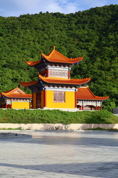 Traditional Chinese Pagoda Temple Surrounded by Green Mountains in Phnom Sruoch, Kampong Speu, Cambodia