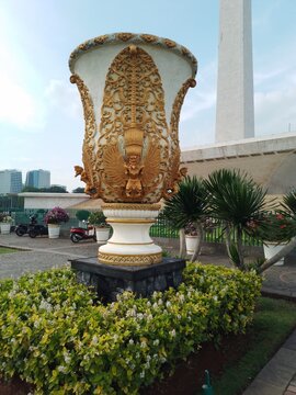 Traditional Indonesian Carved Stone Pot with Garuda Sculpture in Monas Park Jakarta