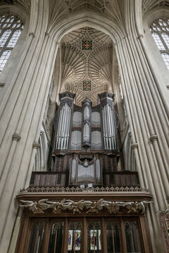 Bath, United Kingdom - 23 July 2026: View of the grand pipe organ inside Bath Abbey, featuring intricate Gothic fan vaulting and tall stone pillars.