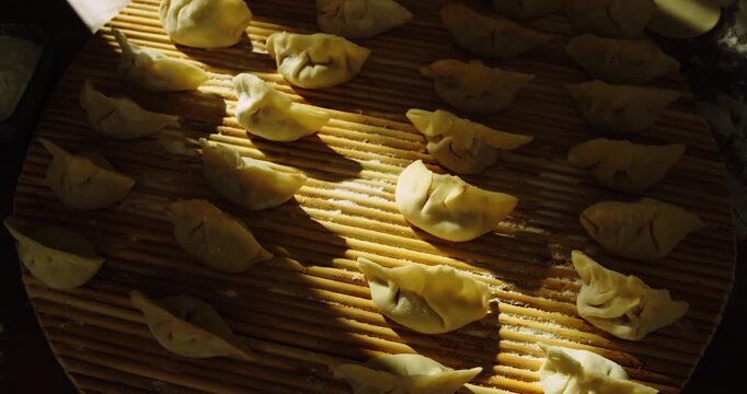 Chinese New Year celebration montage, writing fu character, making dumplings, red lanterns, family reunion dinner Lunar New Year footage