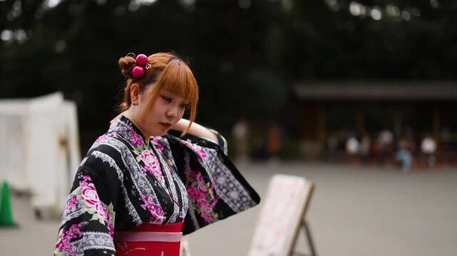 Japanese Woman in Traditional Yukata Posing at Meiji Shrine Tokyo