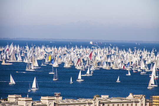 Trieste, Friuli Venezia Giulia, Italy - 10 October 2010: View of the Barcolana Regatta in the Gulf of Trieste with hundreds of sailboats on the blue sea under a clear sky.