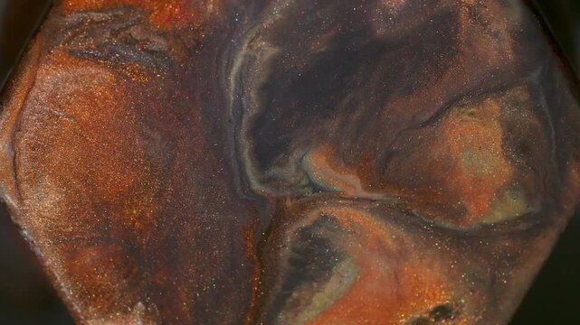 Paint splash. Pigment spill. Defocused orange purple yellow color glitter stone ink geometric particles rhombus floating on abstract art background.
