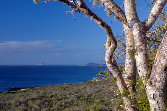 Galapagos islands coast scene with the Kicker Rock monolits in the backgroud