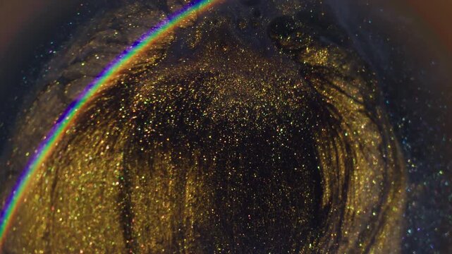 Blur swirl wave. Light rainbow. Defocused bright yellow blue purple color ink glitter particles spatter circling on abstract background.