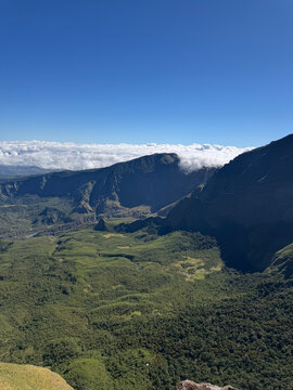 Breathtaking high-altitude panoramic view of Mount Bawakaraeng and the green Lohe Valley seen from Mount Bulu Baria, South Sulawesi, Indonesia
