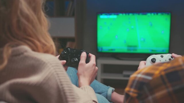 Detailed Closeup of Male Fingers Pressing Buttons on White Game Controller. Unrecognizable Man Plays Intense Football Soccer Video Game Match on Console. High Speed Action Leisure Technology 4k