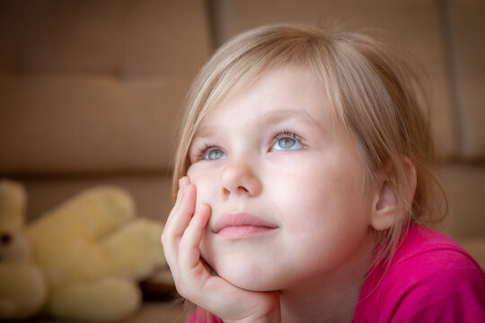 Closeup of a dreaming beautiful little girl