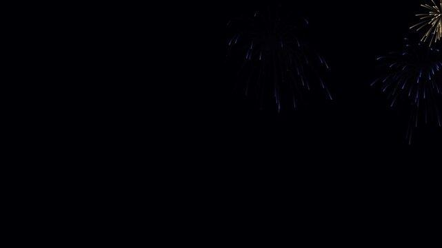 Beautiful blue and gold fireworks exploding in the night sky