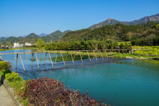 Wooden Footbridge Across Clear River in Jing County, Anhui, China