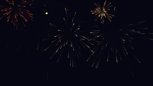 Vibrant golden fireworks display exploding against a dark night sky background.