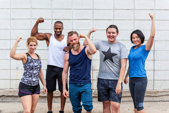 Diverse group flexing muscles photo