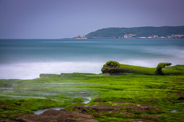 Fototapeta premium Long exposure waves over Laomei Green Reef in New Taipei Taiwan