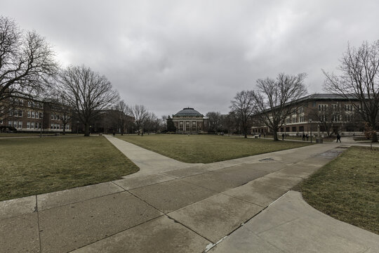 Champaign, Illinois, United States - 18 January 2017: View of Foellinger Auditorium on the Main Quad at the University of Illinois Urbana-Champaign, with historic brick buildings and bare trees.