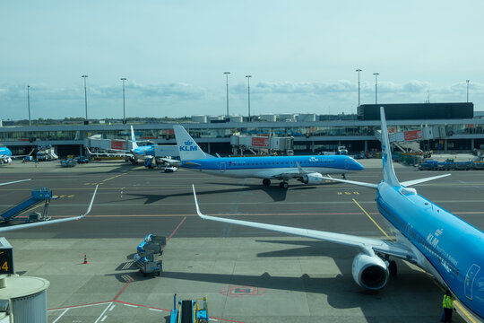 KLM airplanes at Schiphol Airport preparing for travel