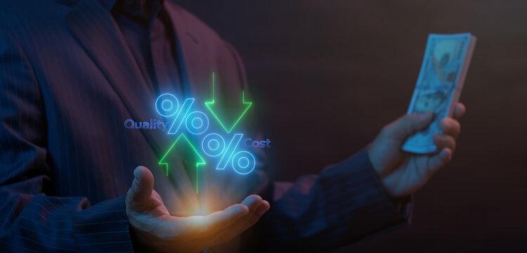 Businessman holding dollar banknotes while open hand supporting glowing percentage icon with Quality up and Cost down arrows. Financial profit optimization and cost reduction strategy concept.