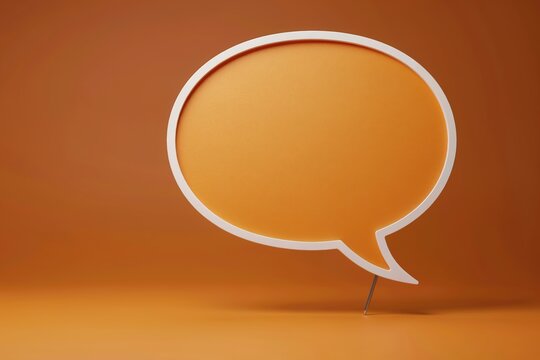 A blank orange speech bubble icon floating against an orange studio background for custom text placement