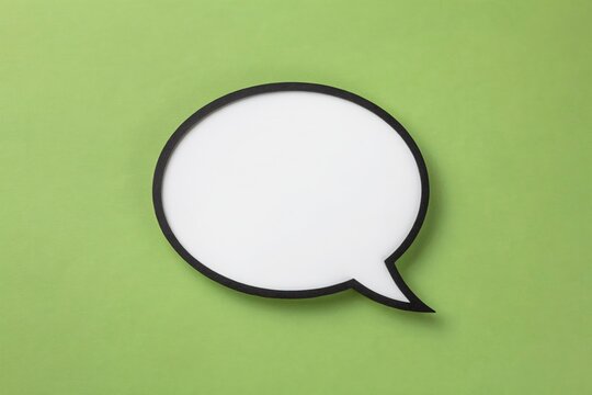 Isolated circular white speech bubble on green background with dialogue communication template conversation