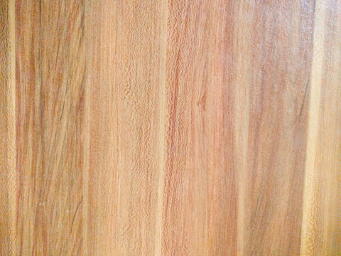 Light brown wooden laminate texture background with natural grain pattern