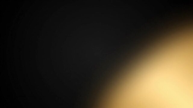 Golden light beam glowing intensely against dark background creating elegant soft motion animation effect for professional cinematic video production use