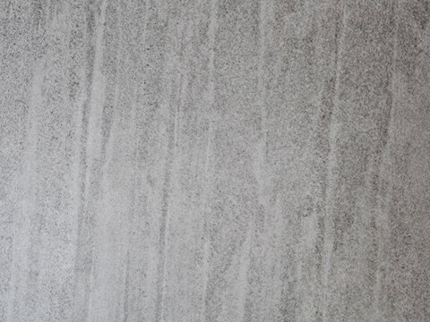 Natural gray concrete wall texture with subtle vertical patterns and realistic surface details. Minimal architectural background suitable for modern design, construction projects, interior decoration,
