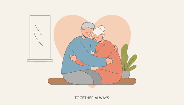 Loving elderly husband and wife hugging each other tenderly against a large warm pink heart shape background.