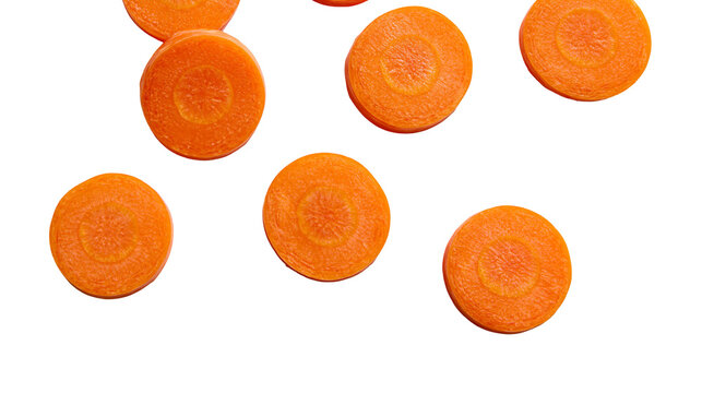 Bright orange carrot slices showing inner rings, isolated on transparent background