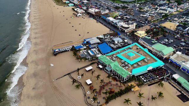 Aerial birds-eye view of Jenkinson Boardwalk and Point Pleasant Beach on an overcast day