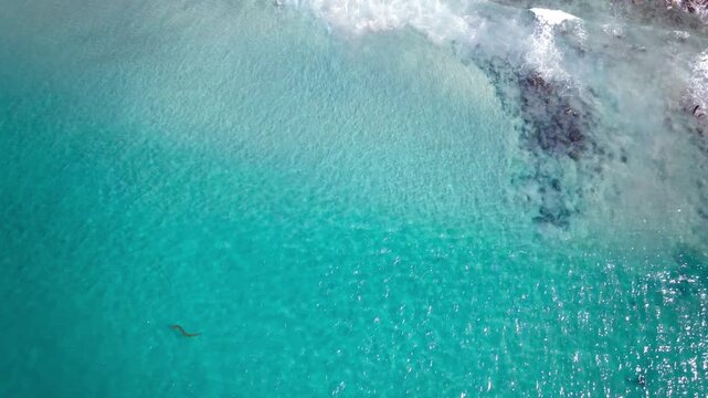 Jewel toned waves and a ruined structure