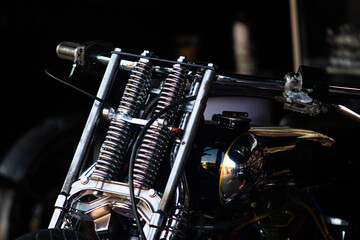 Fototapeta premium Chrome springer fork suspension and handlebar on custom vintage motorcycle