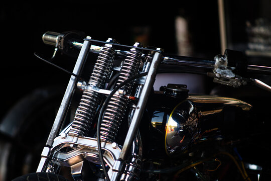 Chrome springer fork suspension and handlebar on custom vintage motorcycle