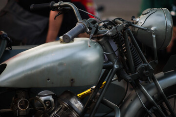 Fototapeta premium Side view close up of olive green vintage military motorcycle with sidecar