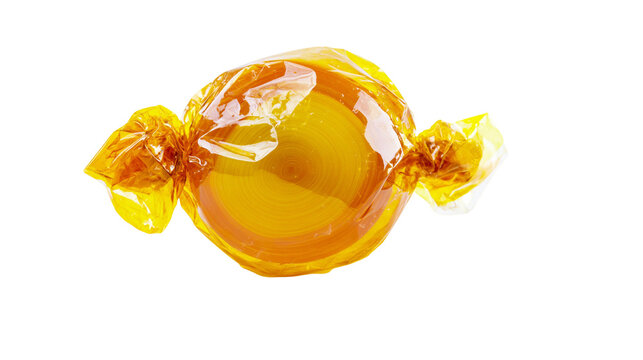 Round golden caramel candy wrapped in shiny orange cellophane, isolated on transparent background