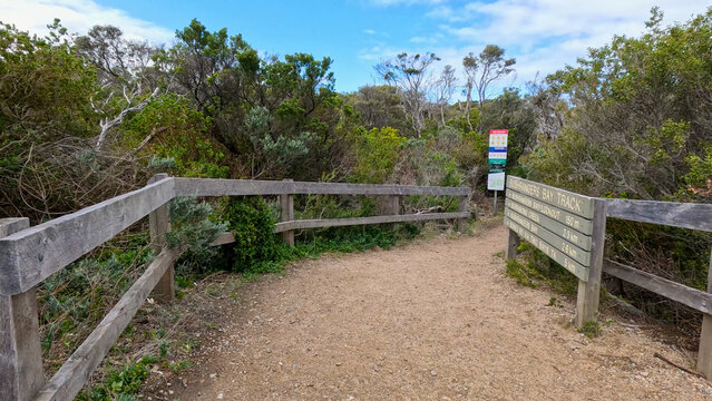 Entrance to Bushrangers Bay Track with Wooden Railing and Signage