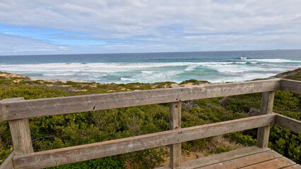 Fototapeta premium Ocean Waves Viewed from a Wooden Lookout Platform in Rye