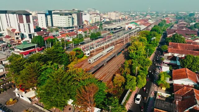 Aerial railway corridor running through dense urban Yogyakarta