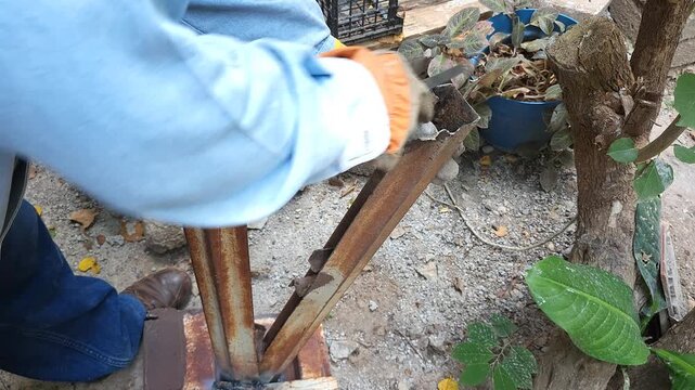 Close Up of Filing and Smoothing Edge of Iron Metal Profile