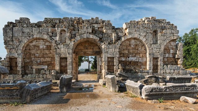 Late Roman Gate ruins at the ancient site of Perge in Antalya, Turkey, featuring stone arches and historical architecture from the Roman period