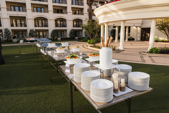 Outdoor catered buffet spread on a lawn for an event