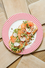 Smoked salmon toast with radish and fresh greens © Cavan
