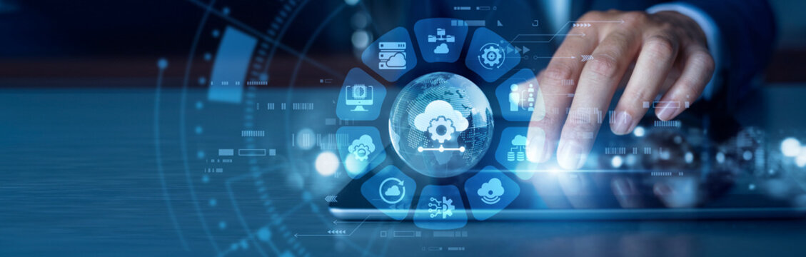 Cloud technology. Software developer working on tablet implementing advanced Platform as a Service cloud frameworks in business world. Digital web hosting, application coding and network system.